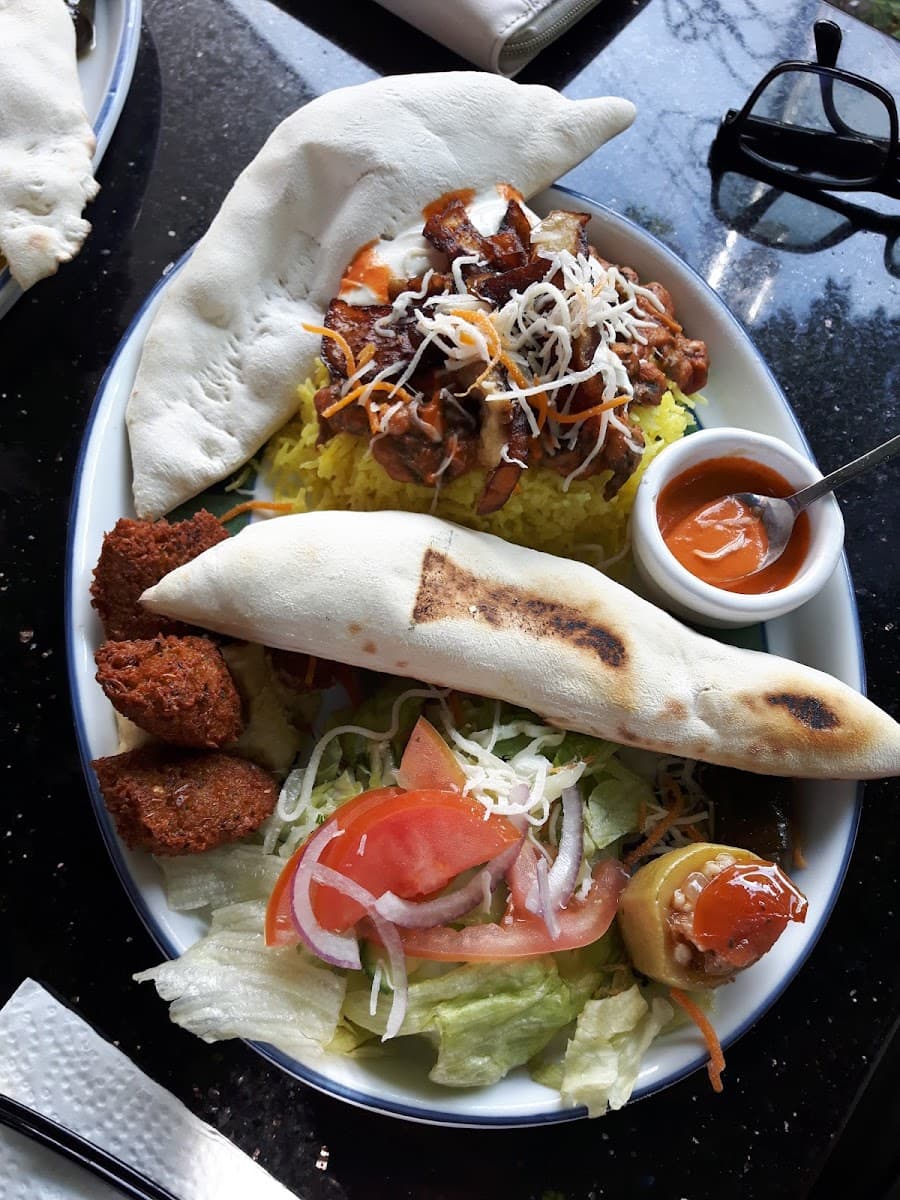Lamb doner platter at Cleopatra: fresh-baked pita, saffron rice, falafel, salad, and house sauce