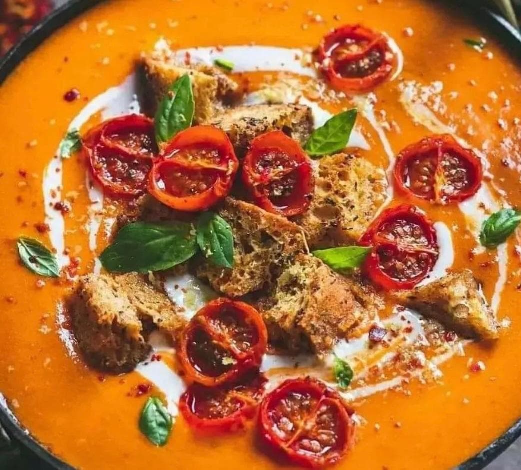 Roasted tomato soup at Cleopatra, topped with herbed croutons, fresh basil, and a swirl of cream